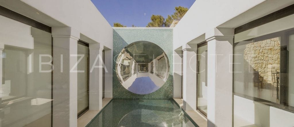 Patio designed with a wall that features a half crystal ball