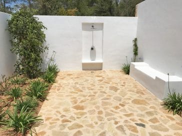 Outside shower with stone way and plants