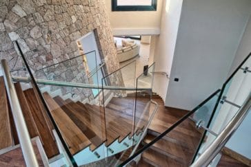 Wooden staircase that connects to living room