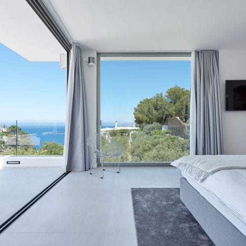 Fantastic sea view from bedroom with private glass wall terrace