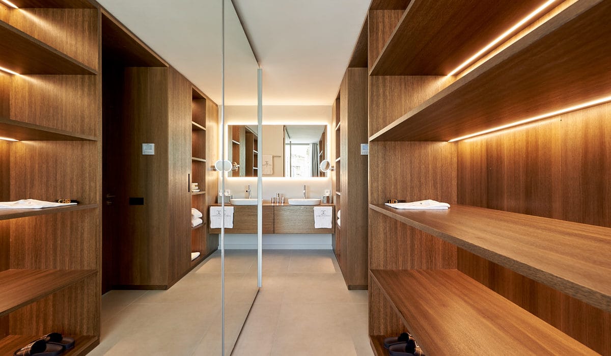 Private wooden wardrobe with bathroom sinks