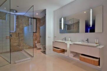 Modern bathroom with 2 sinks, toilet, bidet and walk-in shower