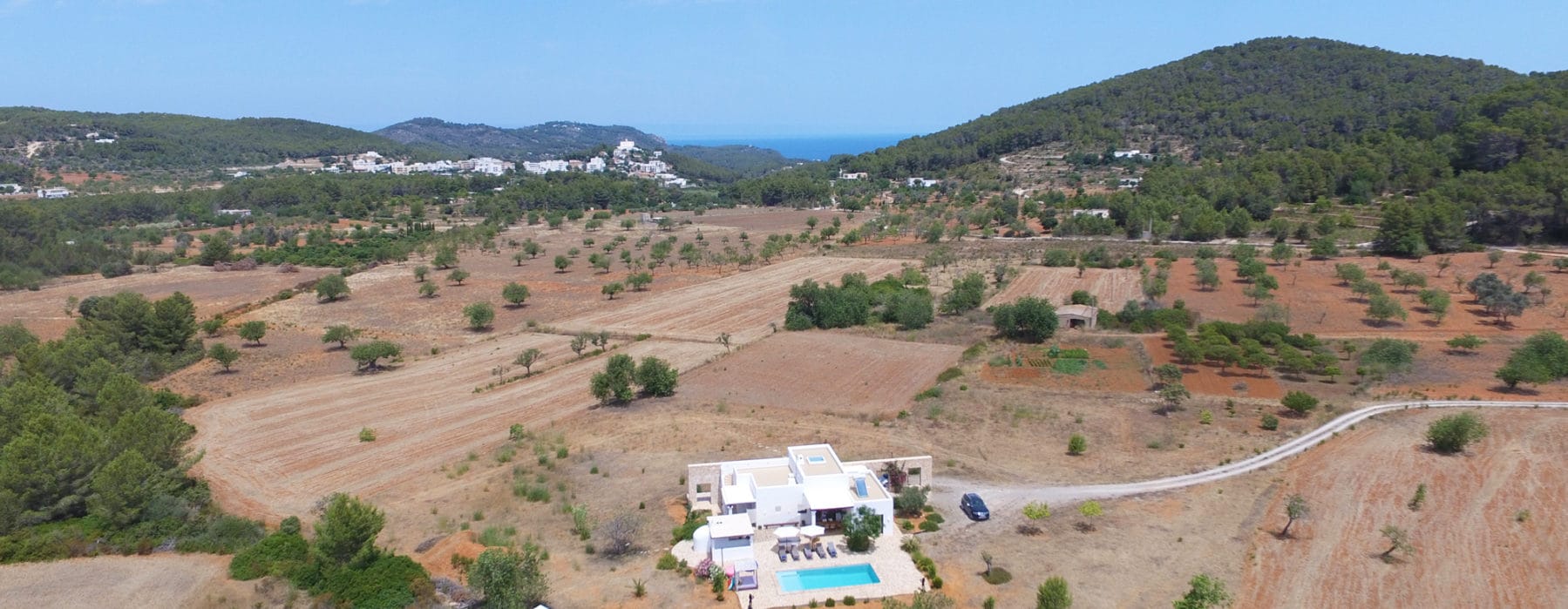 Drone picture from high above of finca emerged in flat countryside