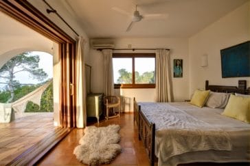 Double bedroom with huge door window open to private terrace