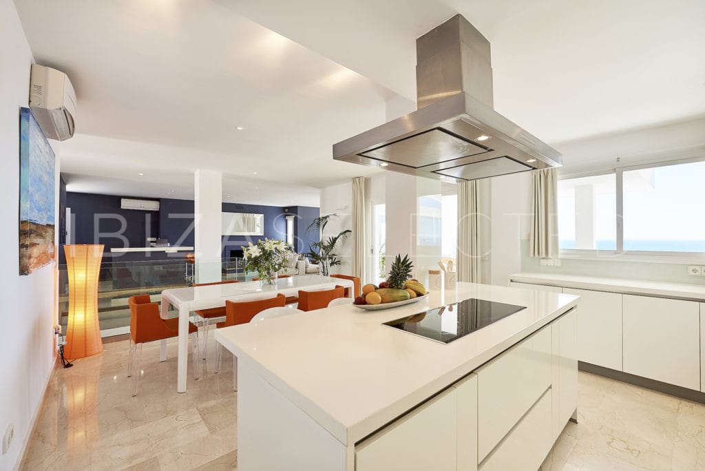 Modern white designed open kitchen with kitchen centre