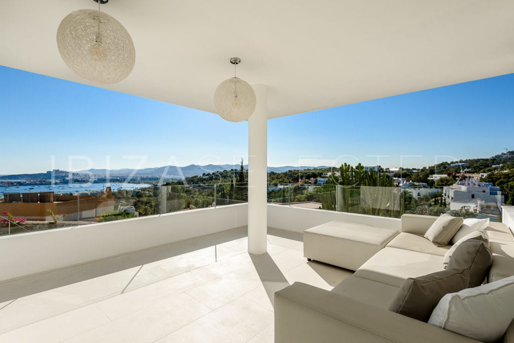 Comfortable corner sofa on the terrace with views to Talamanca Bay and surrounding hills
