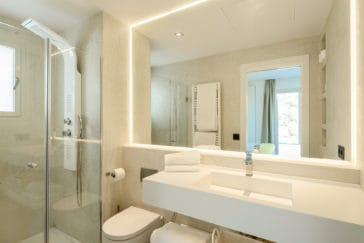 Modern bathroom with one square sink and shower