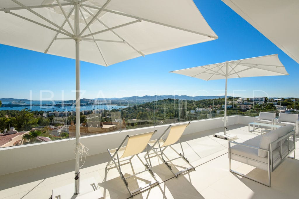 Terrace with seats and a sofa with views to Ibiza's Talamanca Bay