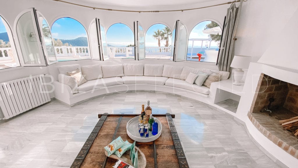 Lounge area with round window wall with views