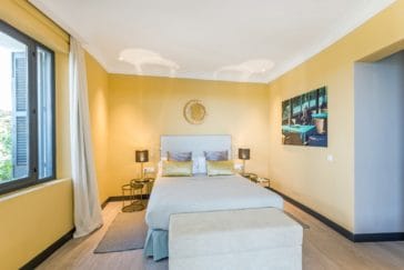 Double bedroom in golden design with window