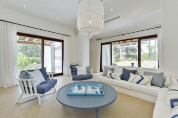 Bright longe area with sofas and armchairs