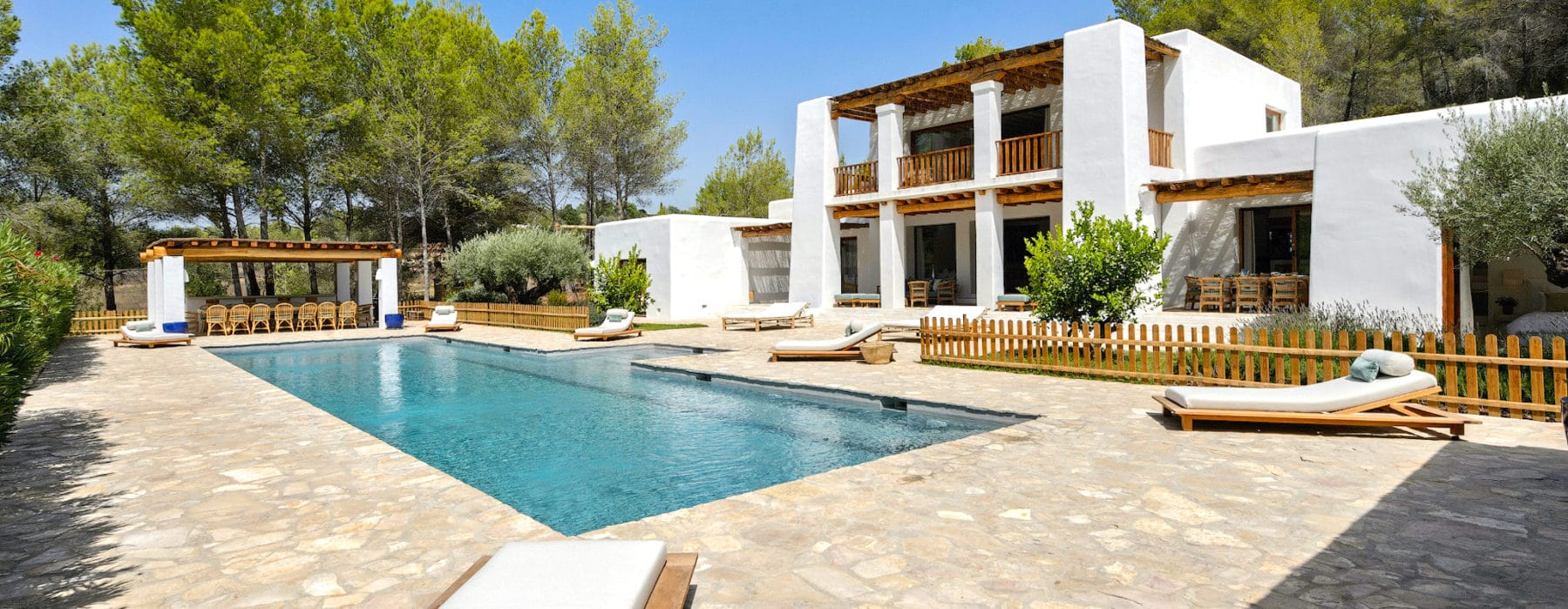 Side frontal view with pool of Ibiza's Villa Blakstad