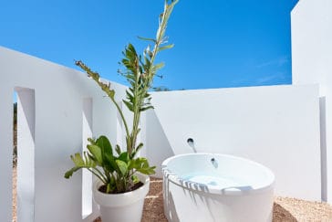 Outdoor round bathtub in private patio