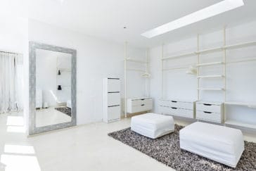 Wardrobe room with white stands and 2 seat cushions