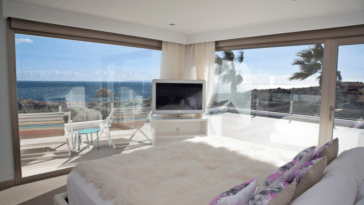 Master bedroom with private terrace and huge corner glass front that offers stunning sea view
