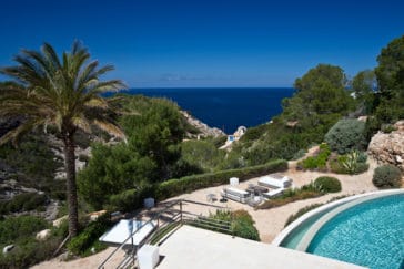 View overlooking part of the lower terrace, pool, garden, landscape through to the sea