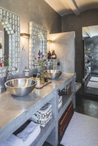 Bathroom with 2 sinks in silver metallic with Moroccan style mirrors