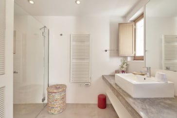 Bathroom with square one sink and walk in shower