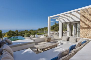 Sofa suite on the villa's open air terrace with views to infinity pool and sea