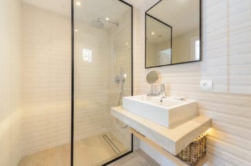 En-suite bathroom with 1 sink vanity and walk-in shower