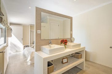 Open en-suite double sink vanity with mirror
