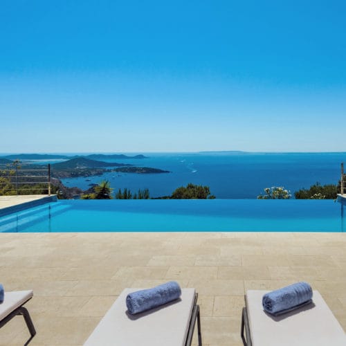 Views from the infinity pool that seems to be continued by the blue sea