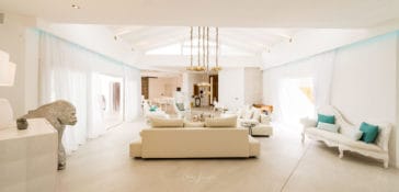 Living room with sofa lounge suite in white and beige colours