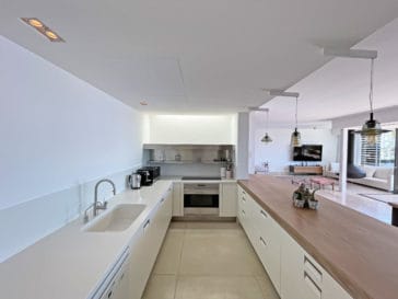 Modern large kitchen with cupboard only on the low level