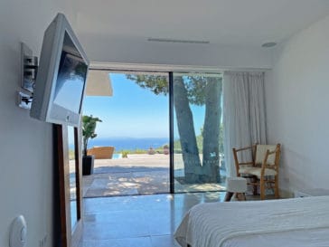 From the double bedroom with large door window wall you have great sea views and direct access to the pool area