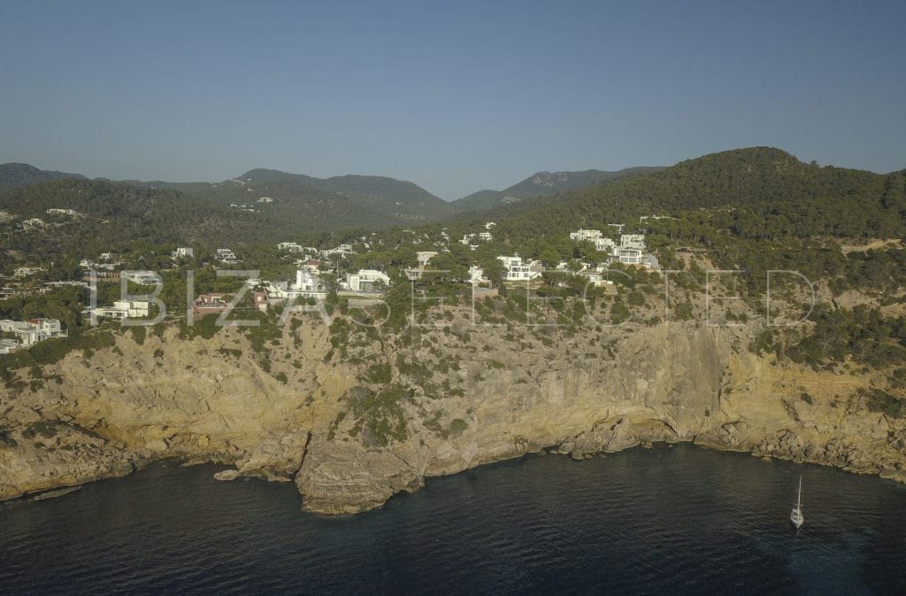 View of Cala Moli bay with high rocks