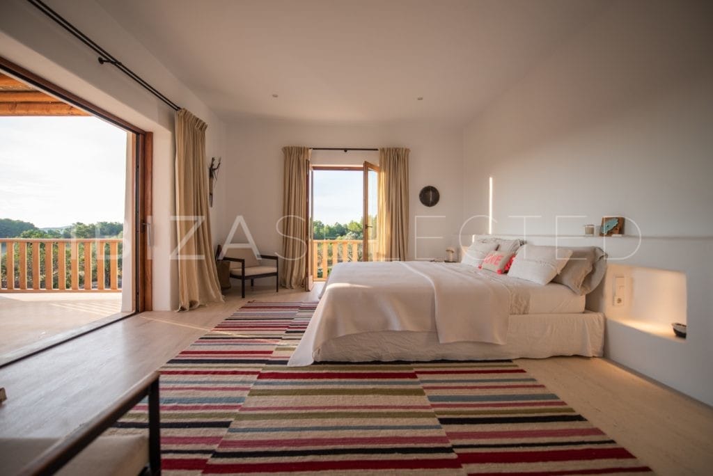 Spacious bedroom leads to terrace at finca Blakstad