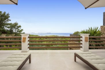 2 sun loungers on terrace with sea views
