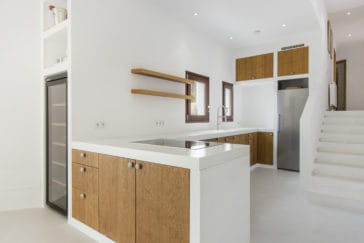 Open modern kitchen in white and wooden design