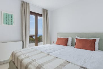 Double bedroom with sea view through door window