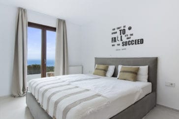 Double bedroom with door windows and sea view